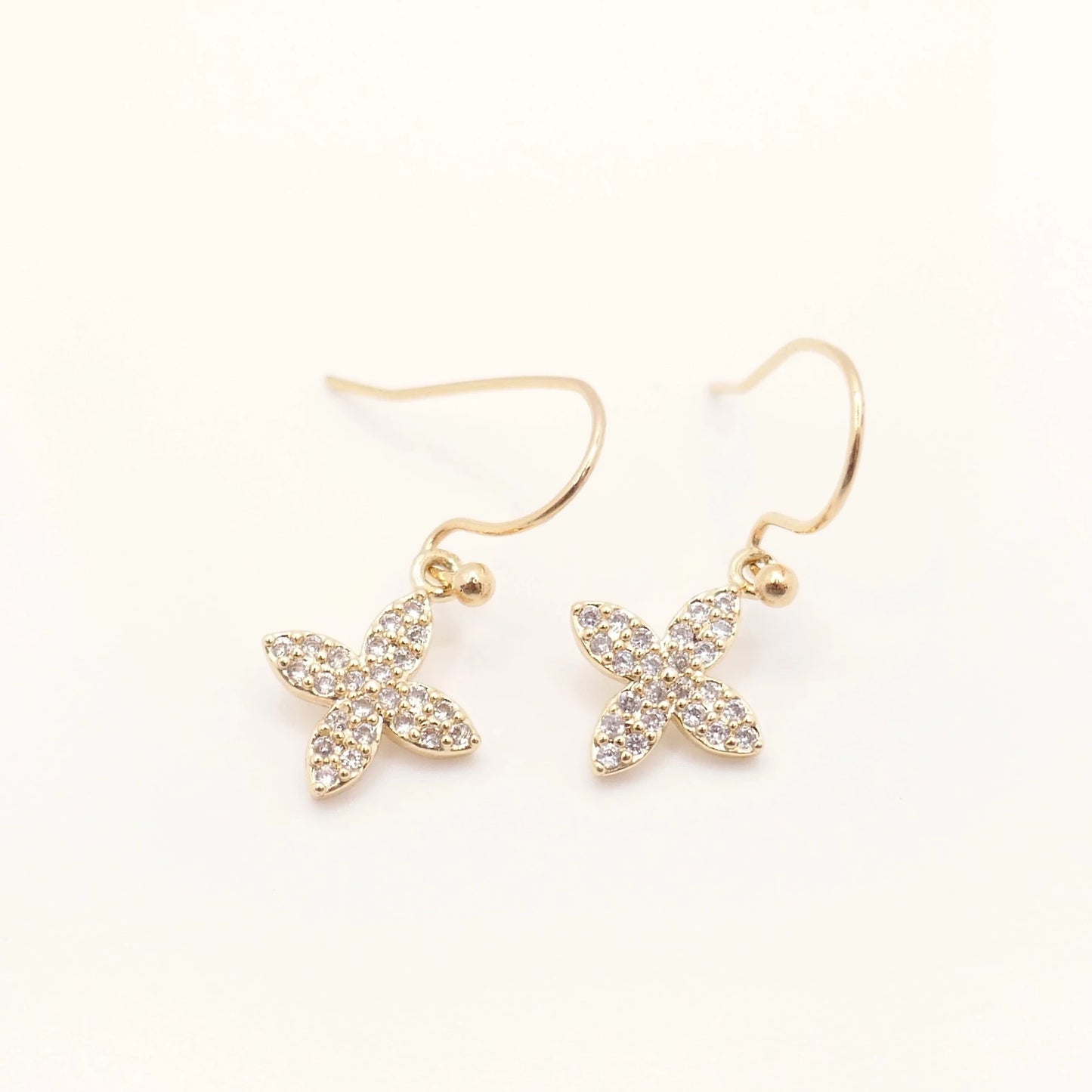 Boucles d'oreilles or et strass pour femme en forme de croix