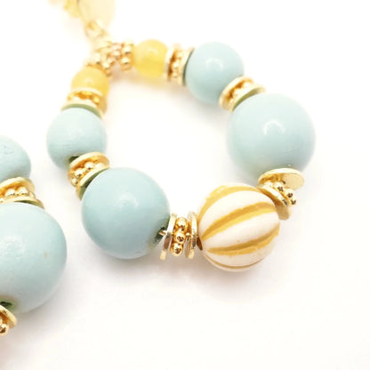 Boucles d'oreilles en perles rondes aux couleurs pastel jaune turquoise et or
