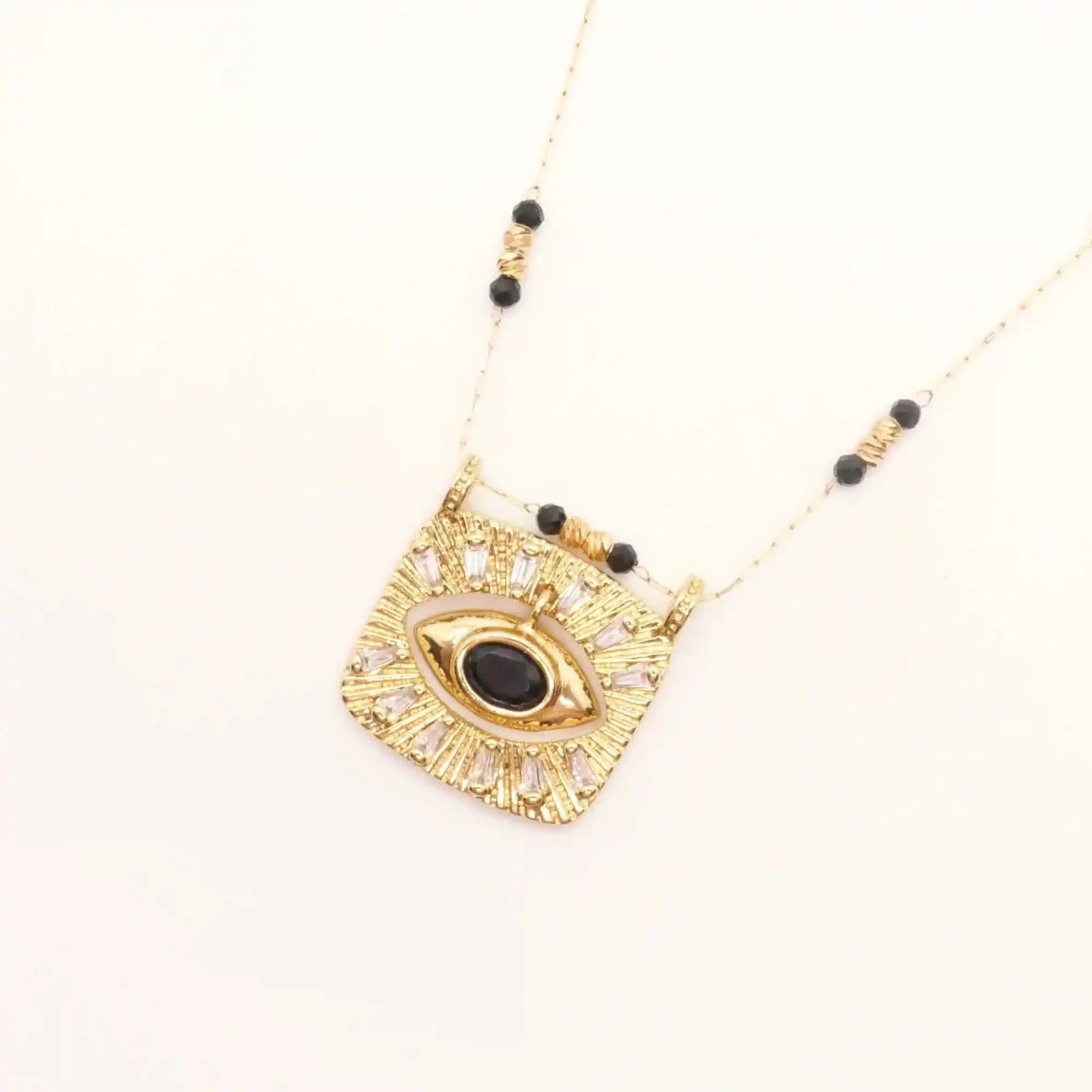 collier oeil long pendentif ethnique doré